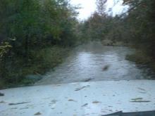 cause i was not about to drive thru this. i've seen jeeps with 44's go under water in that hole in front of me. its a swamp neck meeting to the river/