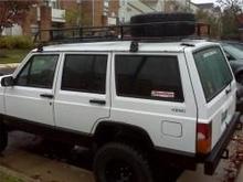 Fabricated roof rack, with Hi-lift jack with mount, Shovel with mount and Spare tire with mount