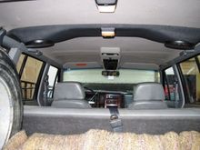 Originally installed in the rear cargo area. I moved it up to just forward of the rear Shoulder belts and was surprised that I did not gain much amplitude for the front seat passengers. I did gain an extra dome light in the deal though...