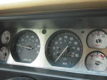 Aluminum bezel on cluster with whitened gauges on the sides backlit by white LED's (not visible in pic/daytime)