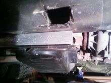 and this is how i got the nut plate out.....i was frustrated and had a grinder, and kinda got out of control....gonna weld a plate over it at some point.....lol