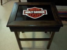 Made this for my dad 2 years ago.  I love how it turned out and had a hard time parting with it.  The HD logo is hand painted on a steel insert that is framed with clear pine stained with a walnut stain and a satin poly.