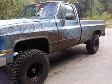 my other wheeler but this ones my daily driver haha.  1981 gmc sierra 350 small block crate motor, th350 trans, BFG mud terrains 35x12.5x15, black crawler rims, 4" lift, posi rear end, dual 24" glasspacks, headache rack, camo interior, kenwood deck and 2 6x9s behind the seat, gun raaaack of course, and some more crap