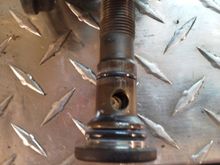 Screw that comes out of the center of.the adapter there are two o rings on here to replace. This takes a t60 torx socket on the newer style.and a 5/8 socket on the older style.