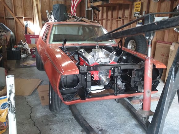 Engine is in. Didn't take very many pics. Its just bolted down for now. Need to come up with a better solution to its location and mounts. Motor mounts are offset 2.5 inches and jenky as heck. I know i want it to go down and forward some.  Not sure how much yet.