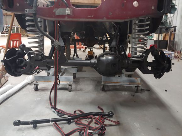 Had to use ratchet straps to pull the axle up with the springs on cause there us no engine in it and no weight.