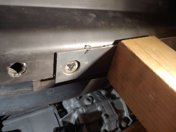 Cut a hole with the holesaw in a 1/8" piece of sheetmetal scrap for a guide to cut the frame/ nut area out.