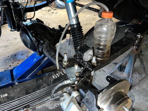My brake bleeding setup. Contains the mess, and the vinyl hose allows me to see when there are no more air bubbles.