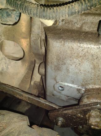 The view from the drivers side of the transfer case, taken by sticking my phone over the front driveshaft.