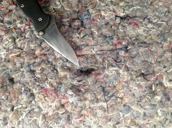 About 8 inches above the latch