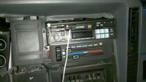 Since it only came with a Jeep AM/FM radio, I threw my old alpine tape deck in so I could listen to my ipod while I was working. I'm getting a new alpine head unit soon.