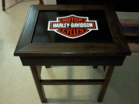 Made this for my dad 2 years ago.  I love how it turned out and had a hard time parting with it.  The HD logo is hand painted on a steel insert that is framed with clear pine stained with a walnut stain and a satin poly.