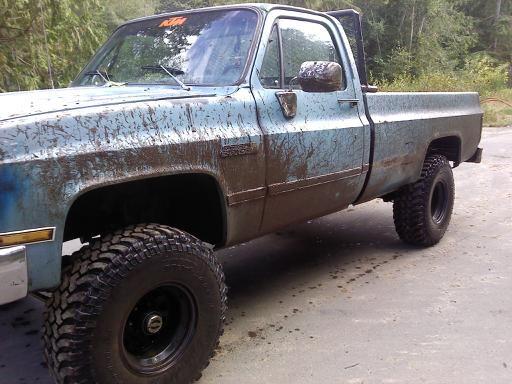my other wheeler but this ones my daily driver haha.  1981 gmc sierra 350 small block crate motor, th350 trans, BFG mud terrains 35x12.5x15, black crawler rims, 4" lift, posi rear end, dual 24" glasspacks, headache rack, camo interior, kenwood deck and 2 6x9s behind the seat, gun raaaack of course, and some more crap