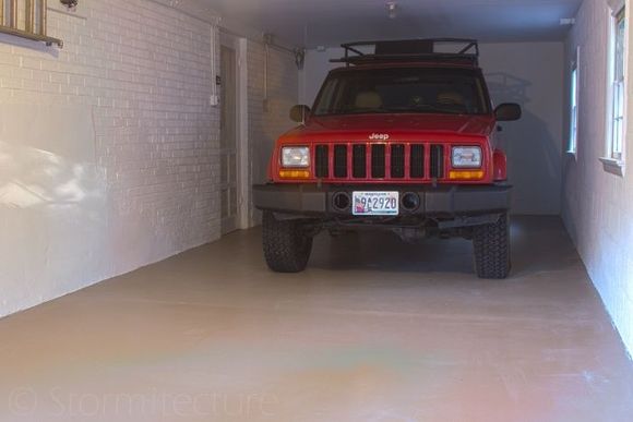 Friends garage, I barely fit (1/4" clearance at garage door opening). Here you see the JK bumper upgrade and DIY roof rack.