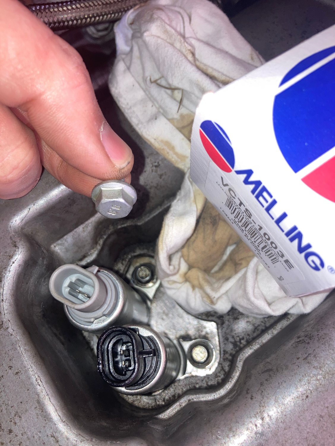 The Mellings kit that came with the VVT sensors included a 10 mm bolt instead of the original 8 mm. I use the originals torque to 89 inch pounds. Hopefully nothing sneaky about this.