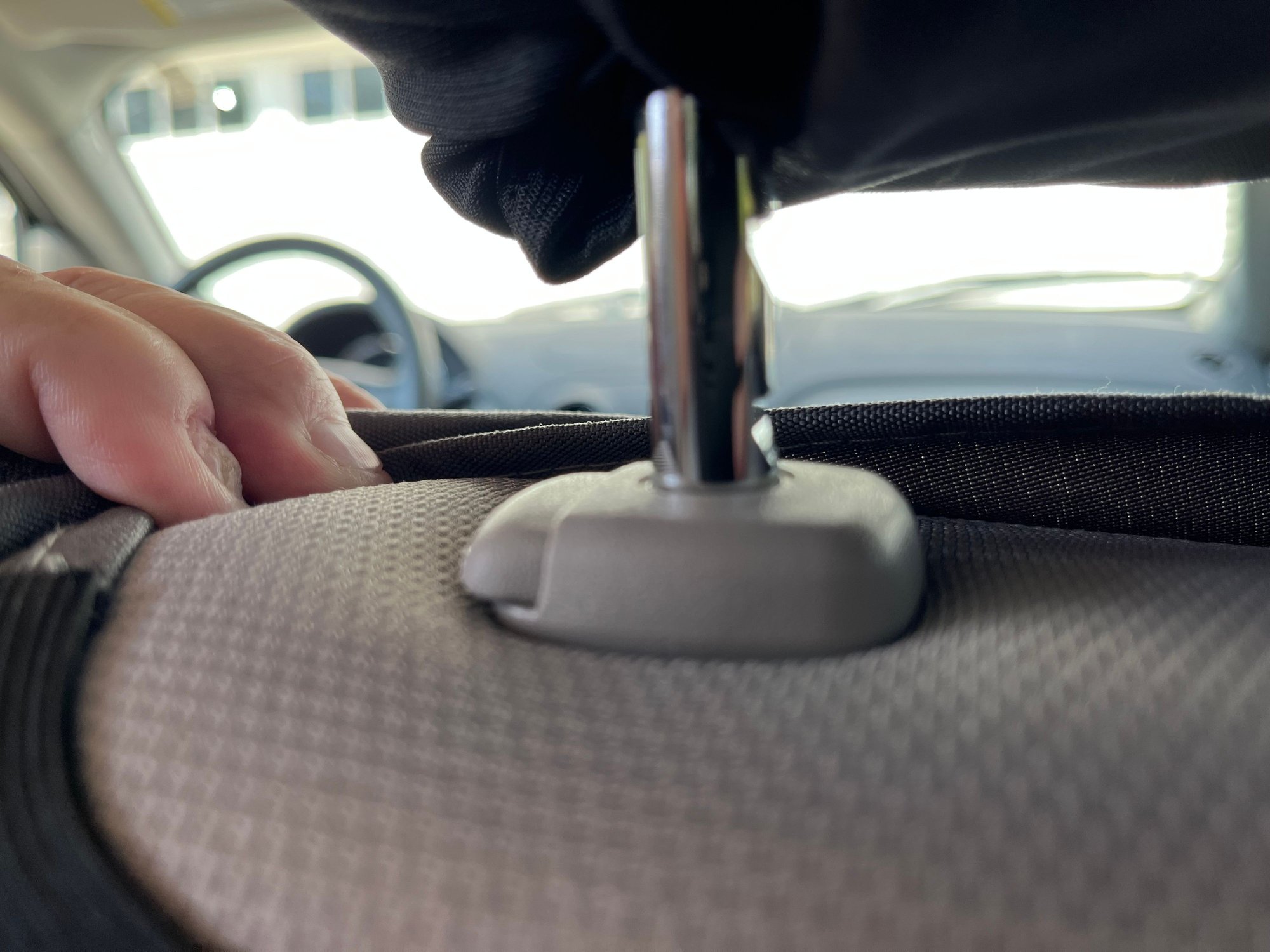 Passenger seat. Left shaft, Notches.  Release button does not engaged. It extends out passed the base.  