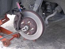 Note the Craftsman screw driver at the top of the brake caliper. I know this isn’t an HHR , but the principle is the same. And if you need more leverage , slide a pipe or floor jack handle over the end of the Johnson bar. 