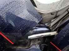 A piece of sofa can cut and bent then 3M double sided taped to the door jam, note how it troughs the water into the front fender away from the hinges