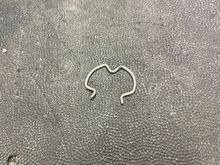 This is a Jesus clip, and holds the cooler line into the radiator. Have extra on hand, you will lose at least 1.