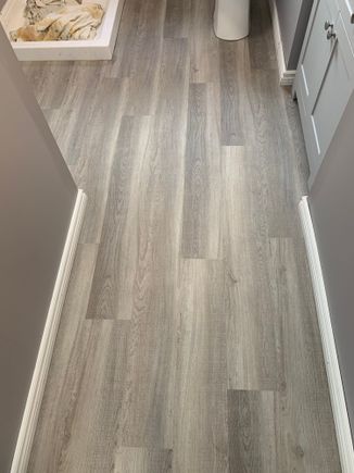 The flooring installed, very easy to work with , it is vinyl so you just measure, square and score it with a drywall knife blade