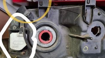 In the red circle the adjuster is still there! This appears to be the passenger side. 
 I’m not sure how the motor is connected to adjust the head light. 
