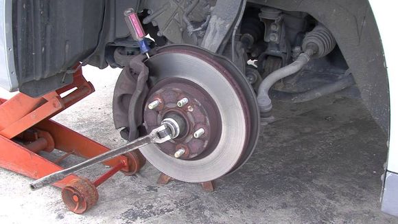Note the Craftsman screw driver at the top of the brake caliper. I know this isn’t an HHR , but the principle is the same. And if you need more leverage , slide a pipe or floor jack handle over the end of the Johnson bar. 