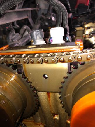 Donbrew has a point slack like this is not good. 
The plastic upper guide is the plastic piece on the underside of the metal piece just above the slack in the chain 