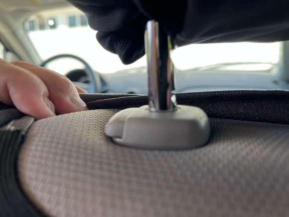 Passenger seat. Left shaft, Notches.  Release button does not engaged. It extends out passed the base.  