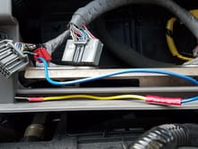 Red tap on amp wire from harness to connected yellow wire. This is to make an extension so that it will reach my aftermarket stereo while it's connected to the dash piece if i have to remove it.
