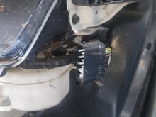 Not sure what plugs here. Headlight?