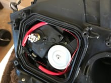 AFS motor mounted to prevent AFS light. No longer functional just moves to trick ECU. 