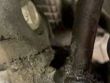 This is where the dipstick enters the pan. It looks like I’ll need to loosen the bolt that secure the dipstick to the side of the motor. That seems easy enough as it is located up higher. This area however will not be easy. This is located behind the oil filter and beside the engine mount. Wish me luck. 