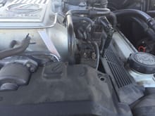 Can sombody help me identify this ruined plug? The wire goes underneath the intake manifold?