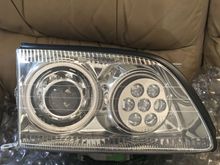 Retrofitted projector headlights with quad angel eyes and RGB demon eyes in high beam with Q45 shrouds