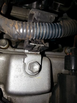 Degraded plastic  clamp on valve cover