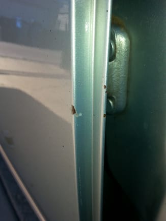 Leading edge of rear door depicting minor nicks..however woth some surface rust 