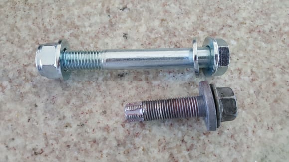 The threads were definitely buggered up on the original bolt.  Sorry, no pictures of the big bolt in place.