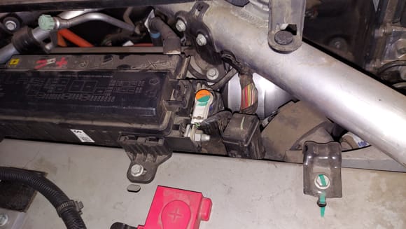 The thing with the orange and green color is the low voltage pyro fuse. The orange and green indicates it is part of the safety restraint system ( airbags).  If you use a jumper wire between the nuts the high voltage contacts for the main battery will engage.  Then the car will move under its own power.