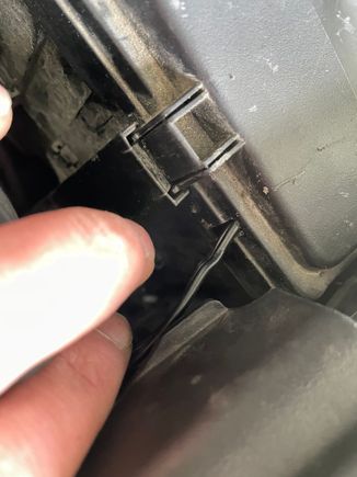 I used a file to cut a slot in the cover allowing the wire to pass through.
