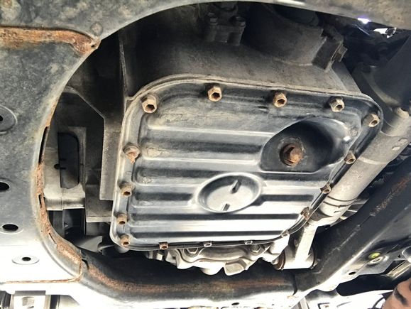 The lower oil pan is bolted on onto the upper oil pan here in this photo. I cannot find this part to save my life I need help asap.