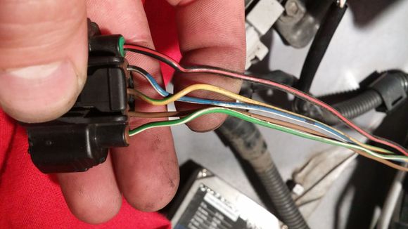 Here is a close up of the Mass Air Flow sensor in a 97+ OBDII car. You can see here the Blue w/ White wire that will be used for the MAP Signal wire, and the Brown wire and the Yellow w/ Green to be used for the IAT Sensor.