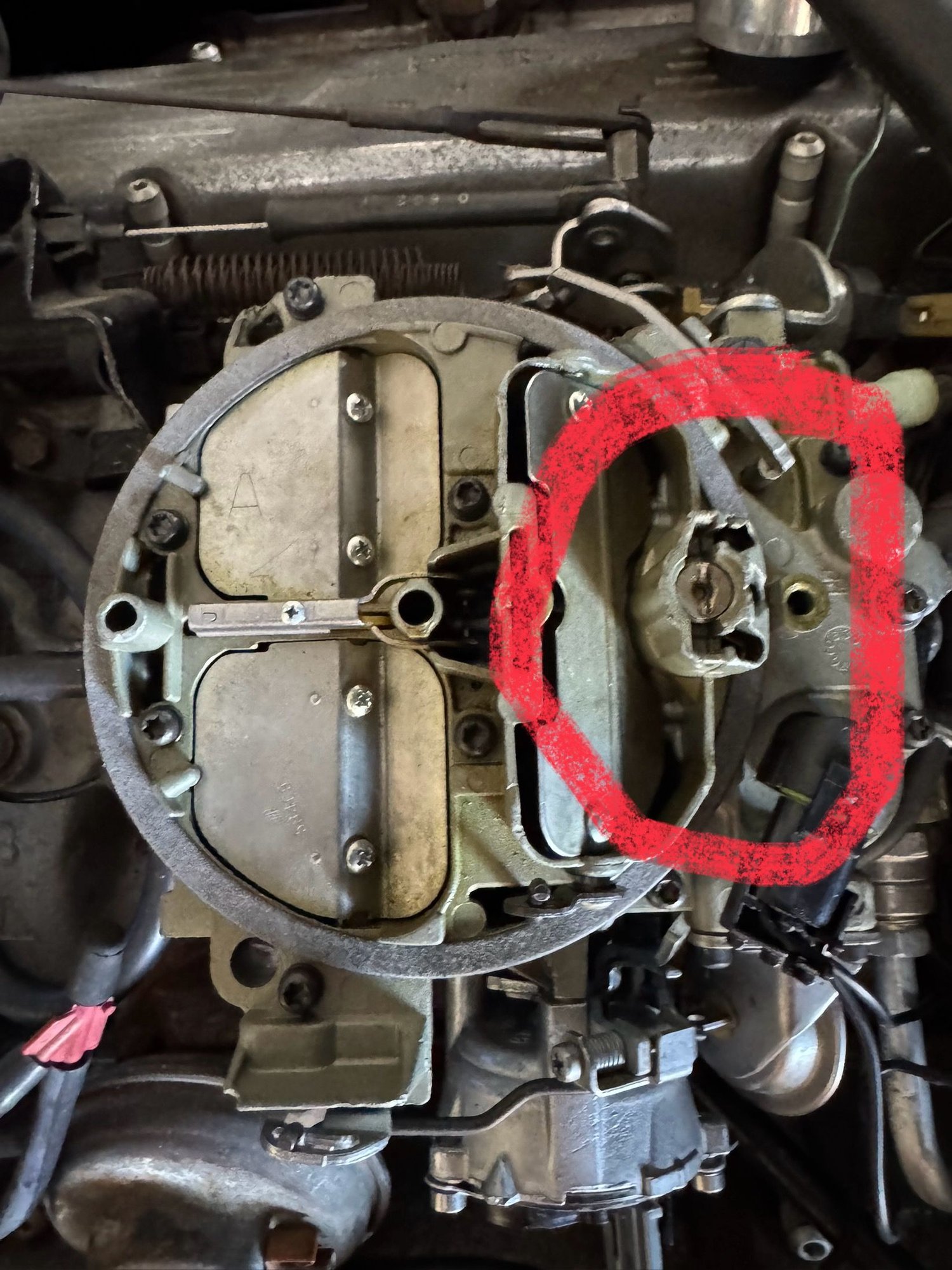 The screw that goes in the hole to the right is missing.  I need to know what it is, if there is an assembly under it, and if anyone knows where I can order it.  I have a manual but it doesn�t describe it or what it does.  Thanks in advance 