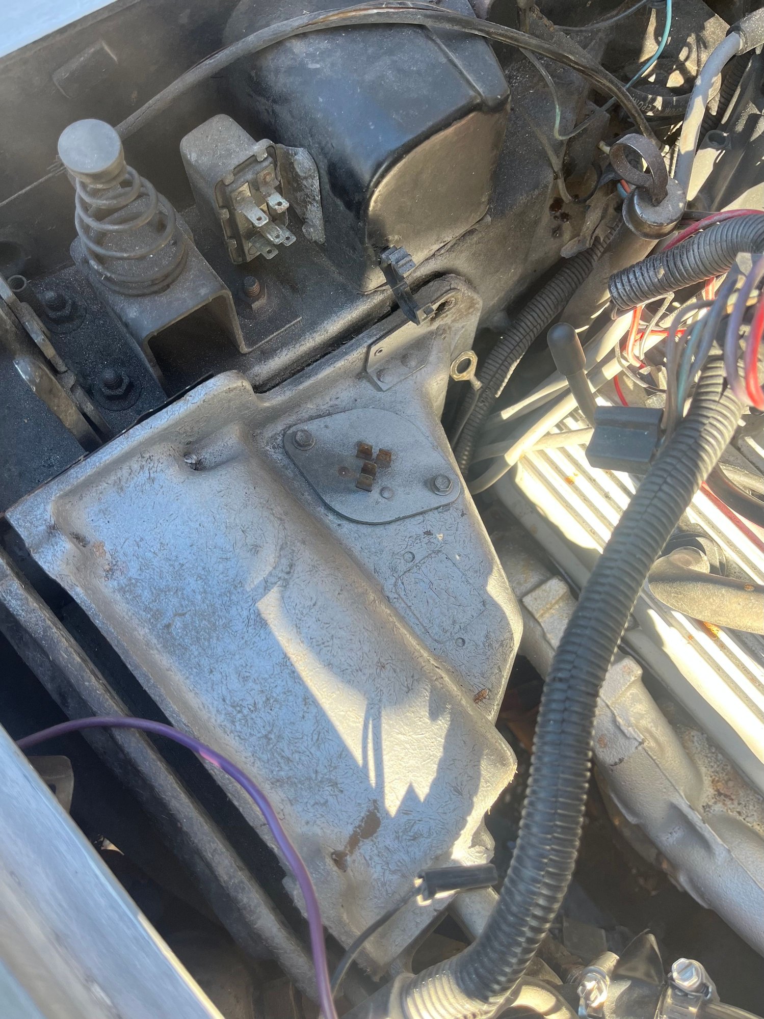 Getting at the two hoses in the engine bay, underneath this section of the heater box where they attach to the copper tubing that comes out of the heater core is next to impossible�