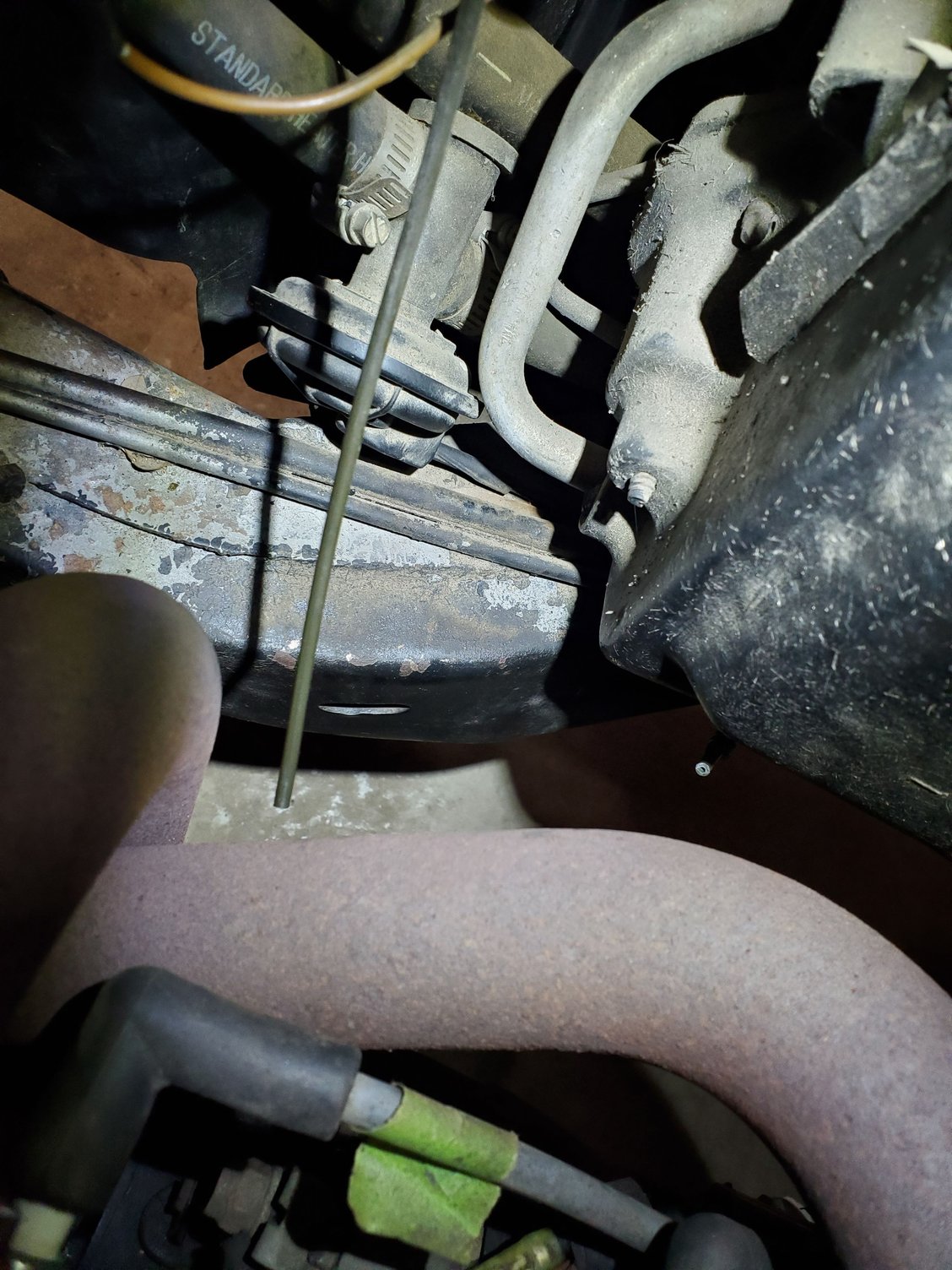 Peeking over passenger side, looking down into engine bay