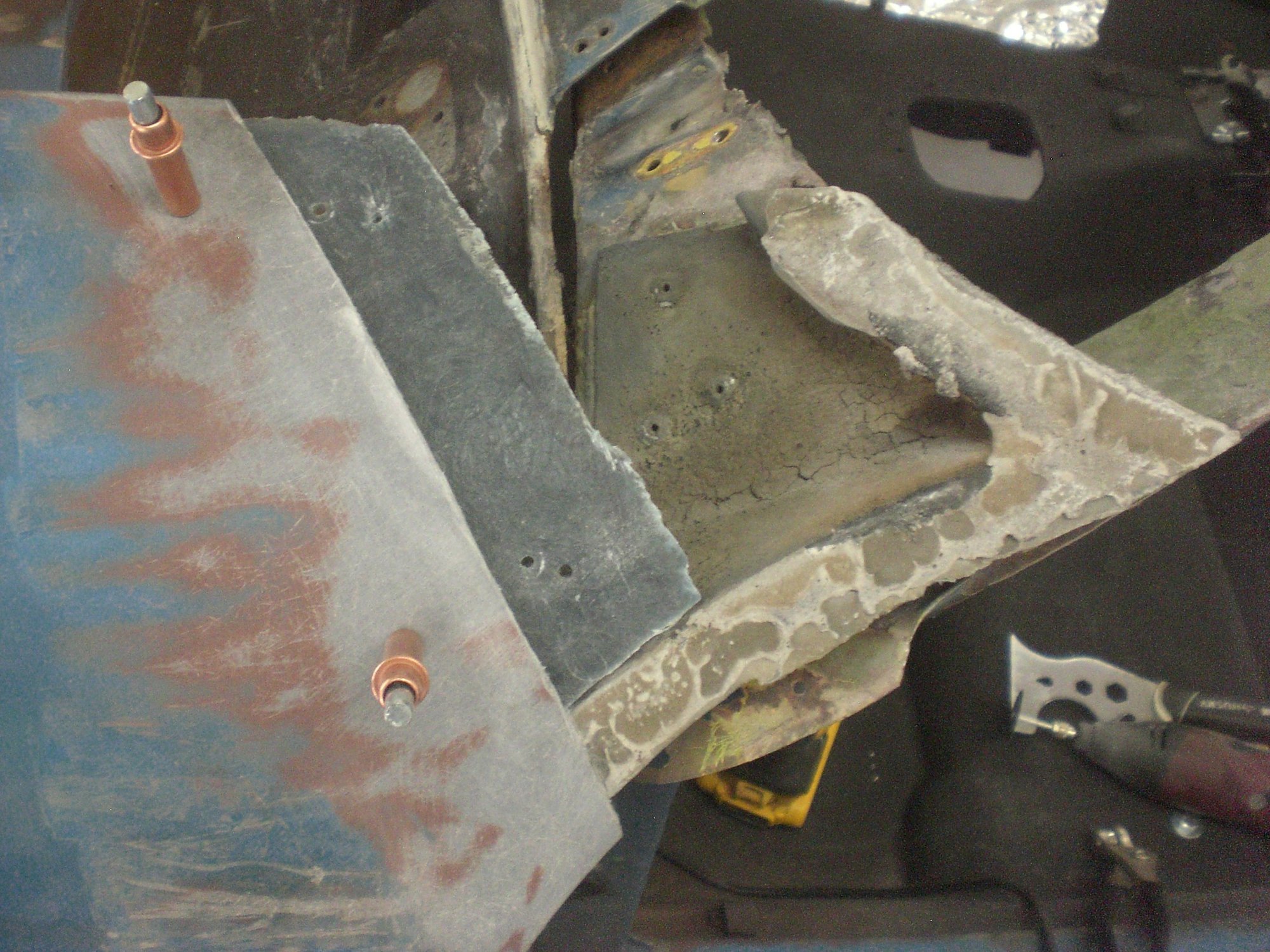 Bonding strip held to fender with clecos