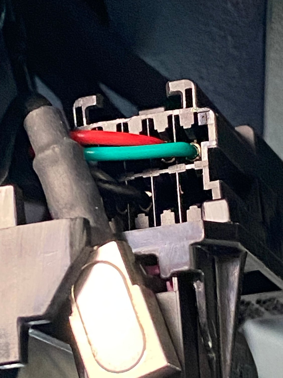 With the cover removed, the wire tap is east. Red to red on the top row and black to black middle of the bottom row.
