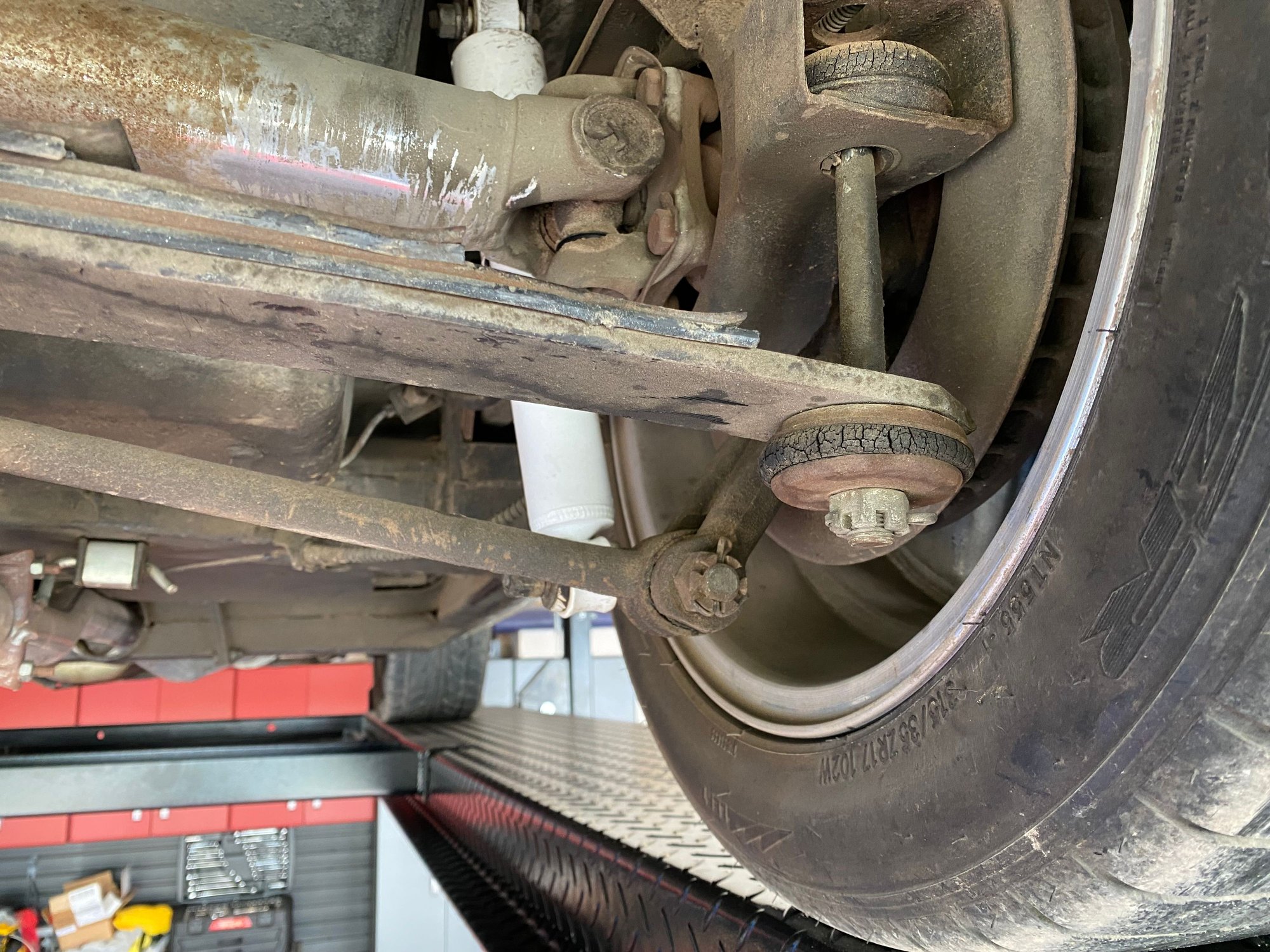 I don’t think longer bolts are going to work to lower the rear, the spring is about 3/4” from the wheel.