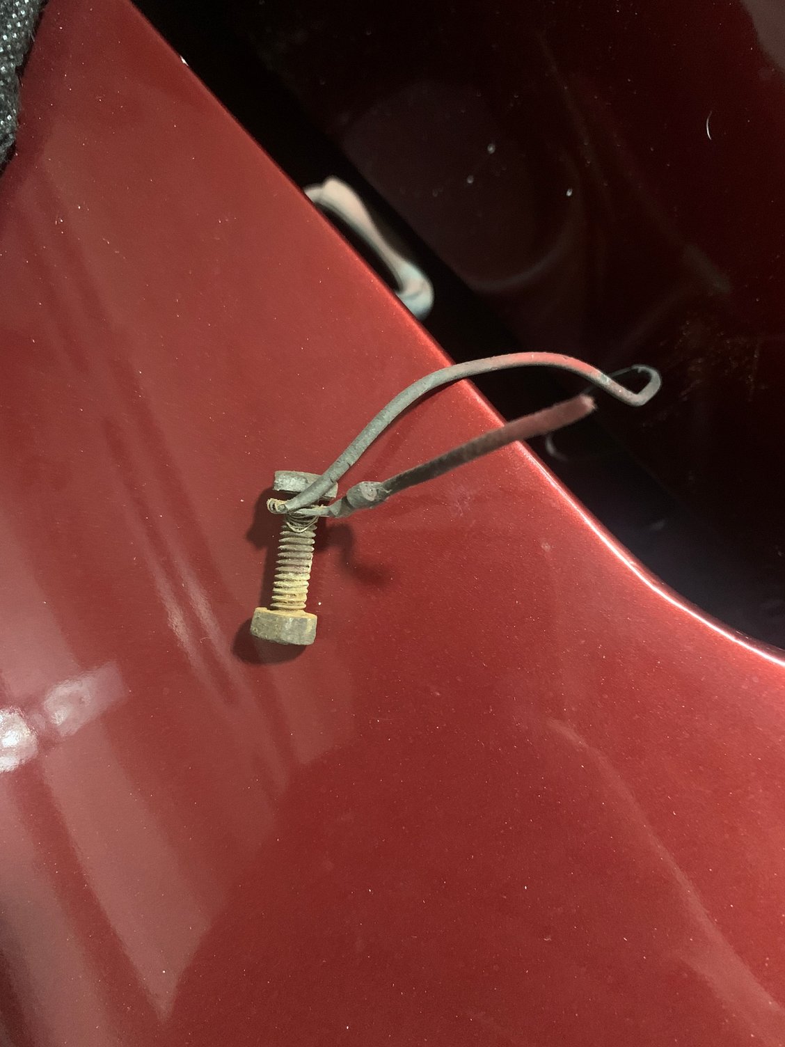 Mystery wire and broken wire attached to one of the 3 mounting bolts