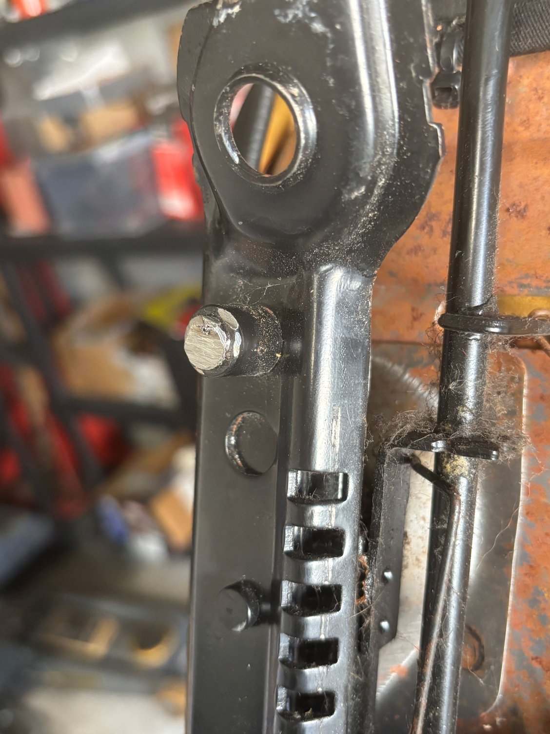 Cut it off and use to locate the bracket�s height. Simply fill with wire. 