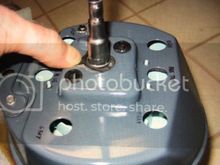 By pushing the cable towards the speedo head, you will be releasing the tension on the spring like clamp.